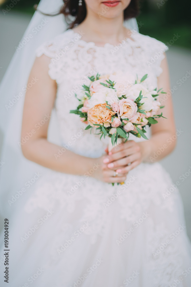 bride in nature with a beautiful wedding bouquet bride in nature with a beautiful wedding bouquet