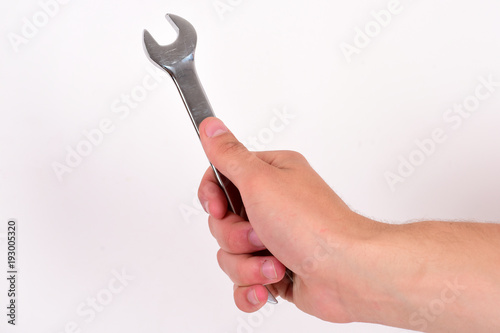 Service and construction concept. Wrench tool in male hand