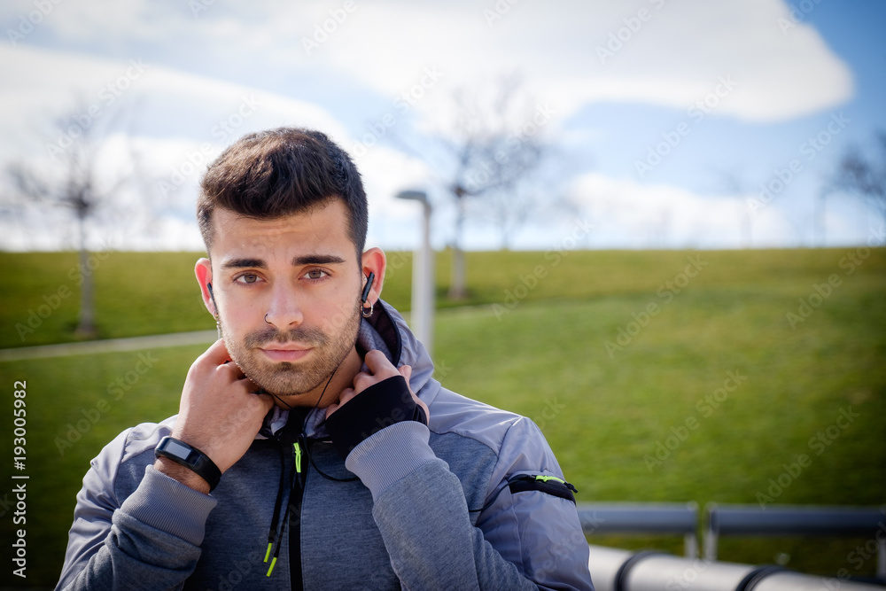 Young athletic man is preparing before running. Young athletic man is preparing before running.