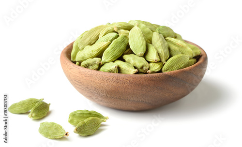 closeup of dried cardamom in the wooden plate