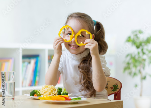 kid girl having fun with fo...