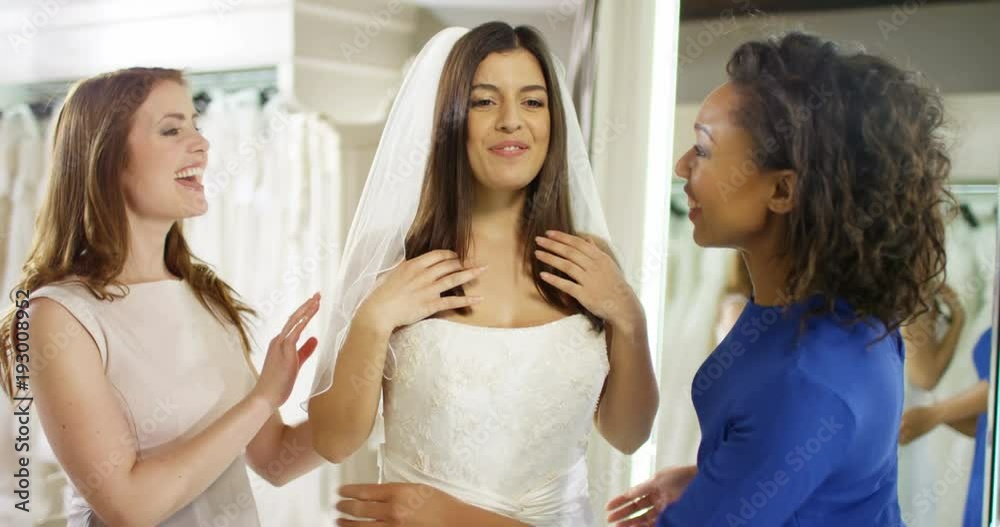 custom made wallpaper toronto digital4k, Woman trying on wedding dress with her friends at a bridal store. Slow motion.