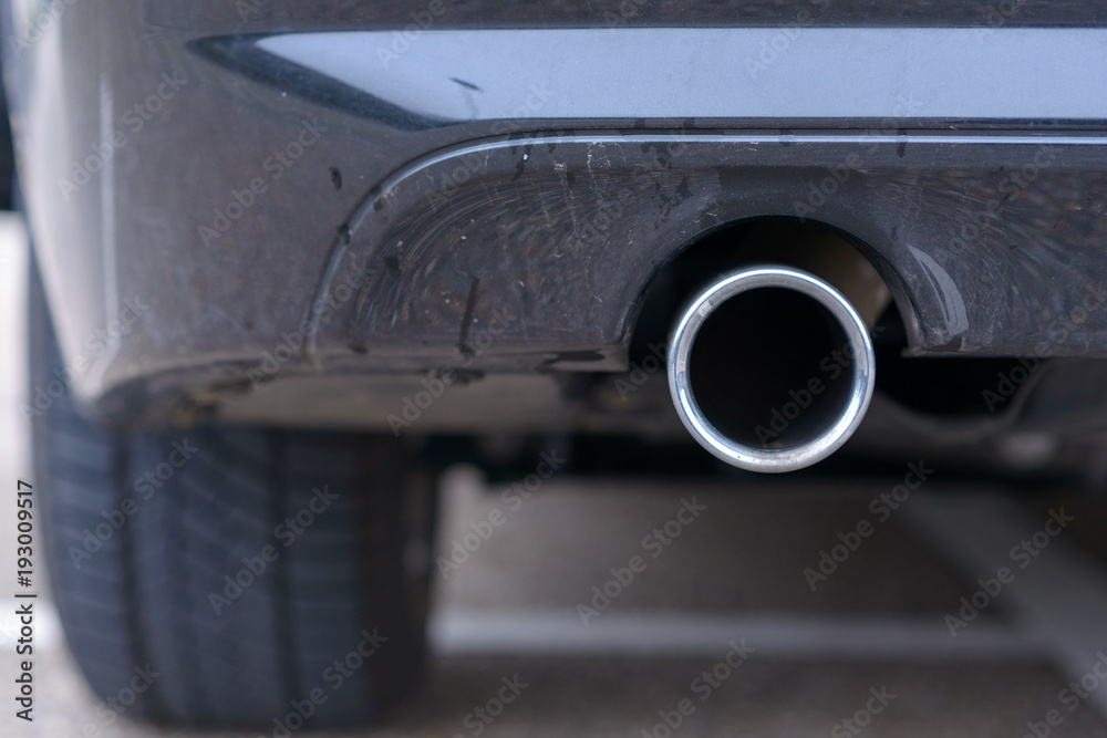 Low angle view of the exhaust pipe of a car