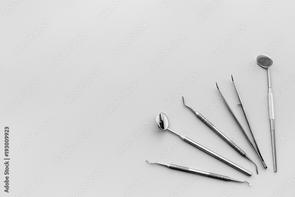 Dentist tools. Teethcare, dental health concept. Grey background top view copy space Dentist tools. Teethcare, dental health concept. Grey background top view copy space