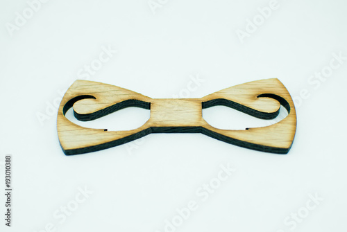 Wooden shape of bow tie. Hipsterish style 