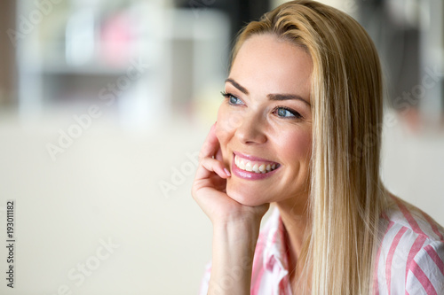 Portrait of cheerful young beautiful blonde woman