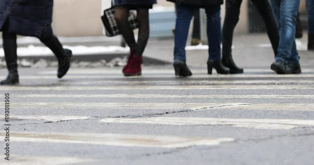 people crossing the crosswalk in the city. slow motion people crossing the crosswalk in the city. slow motion
