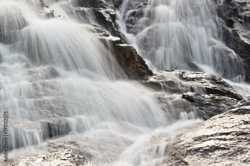 Mountain waterfall on a summer day