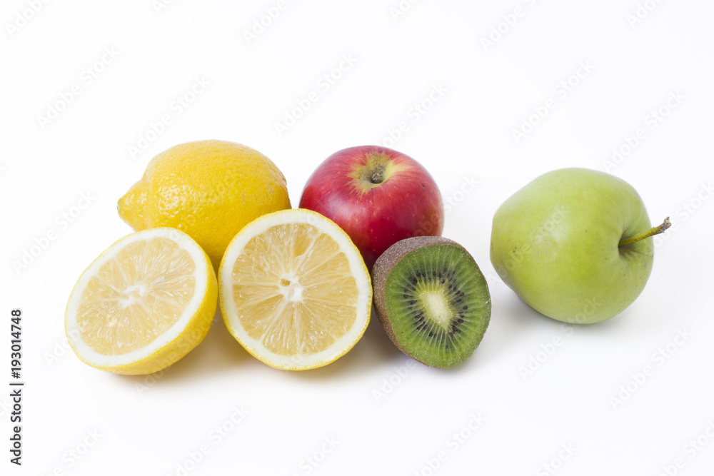 Fruits in a composition on a white background. Lemon with apples and kiwi on white background. Fruits with carrots on a white background. Fruits in a composition on a white background. Lemon with apples and kiwi on white background. Fruits with carrots on a white background.