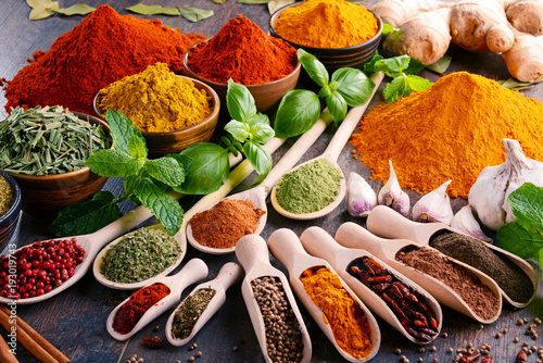 Fototapeta Naklejka Na Ścianę i Meble -  Variety of spices and herbs on kitchen table