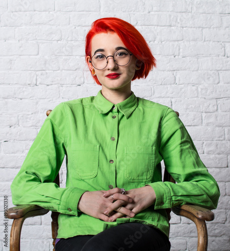 Shooting in the Studio. Portrait of a young girl with big glasses.
