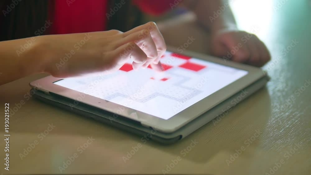 girl teen plays in a tablet draws on a online game. girl child social media tablet internet indoors slow motion video girl teen plays in a tablet draws on a online game. girl child social media tablet internet indoors slow motion video
