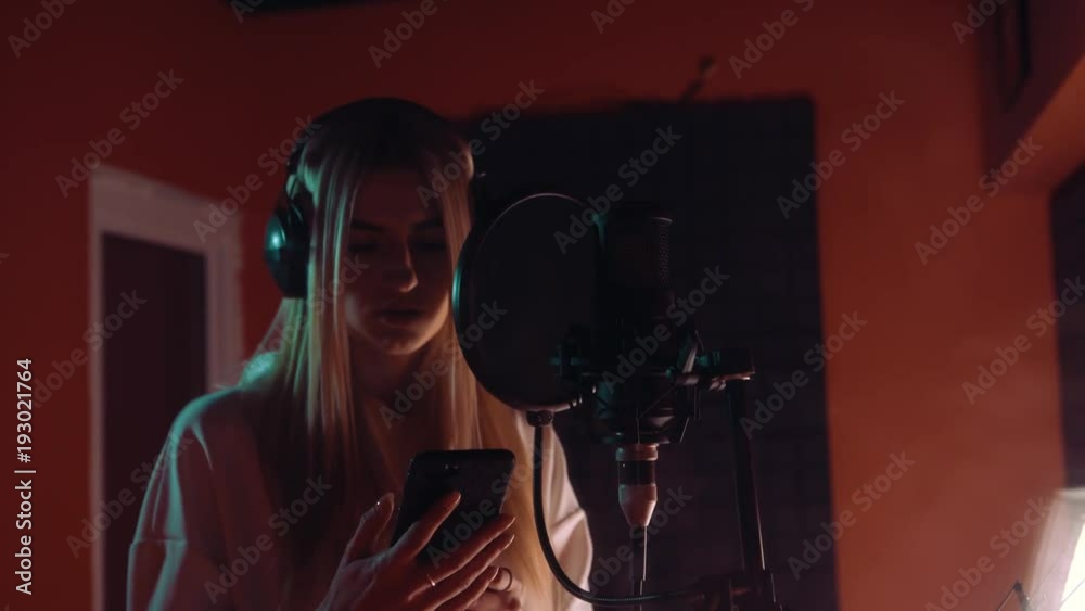 beautiful girl singing into a microphone beautiful girl singing into a microphone
