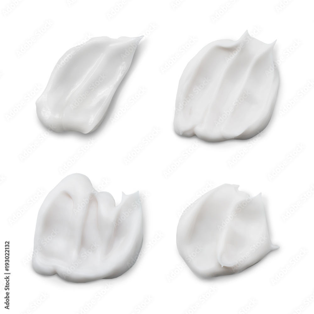 Set of white creamy cosmetic product smears isolated on white background