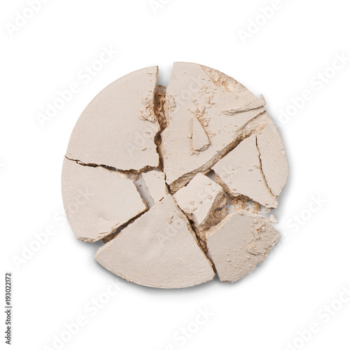 Close up of light nude coloured crushed mineral powder isolated on white background © Kateina