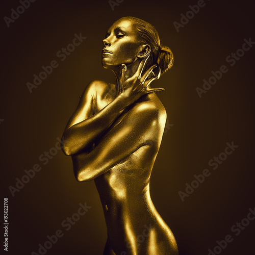 Golden lady on dark background