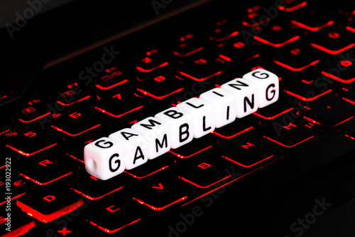 Gambling symbol on illuminated keyboard photo