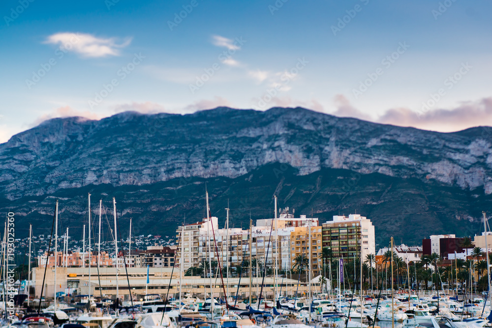 Denia port with castle and mountain montgo hill and yacht in alicante province Spain