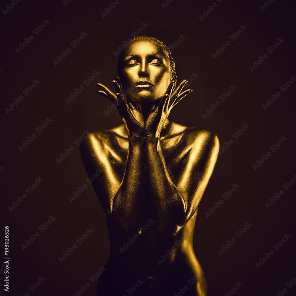 Golden lady on dark background