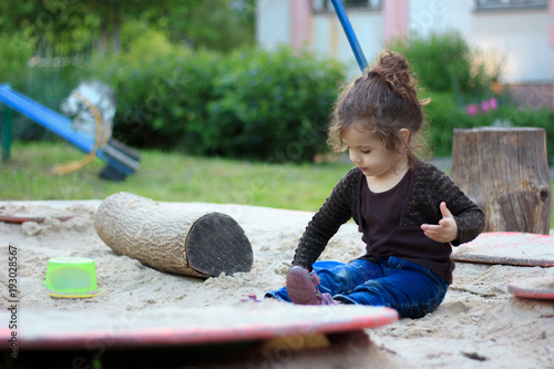 Little kid girl playing in ...