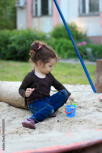 Little kid girl playing in ...