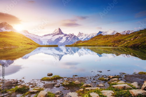 Panoramic view of the Mt. Schreckhorn and Wetterhorn. Location Bachalpsee in Swiss alps, Grindelwald valley, Europe.