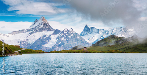 Great view of Mt. Schreckhorn and Wetterhorn above Bachalpsee lake. Location Swiss alp, Bernese Oberland, Grindelwald, Europe.