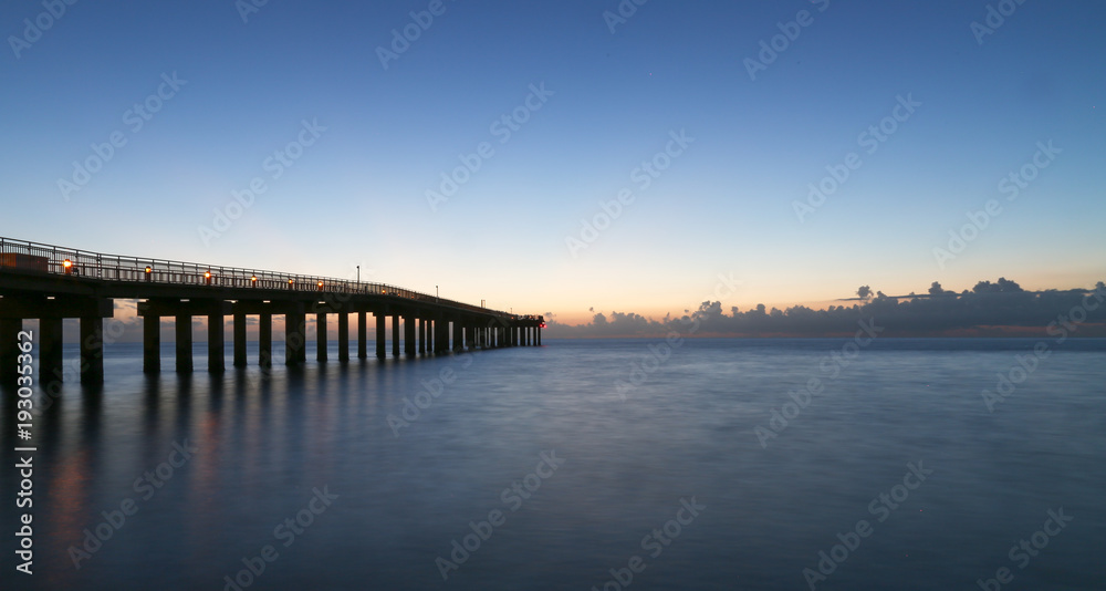 Sunrise on the beach , The sky takes on shades of orange during sunrise and sunset. Watch the sunrise. Watch the sunset. 