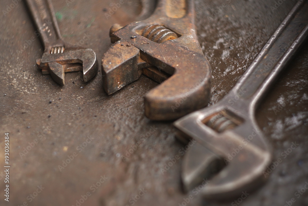 a set of old rusty adjustable wrench close up a set of old rusty adjustable wrench close up