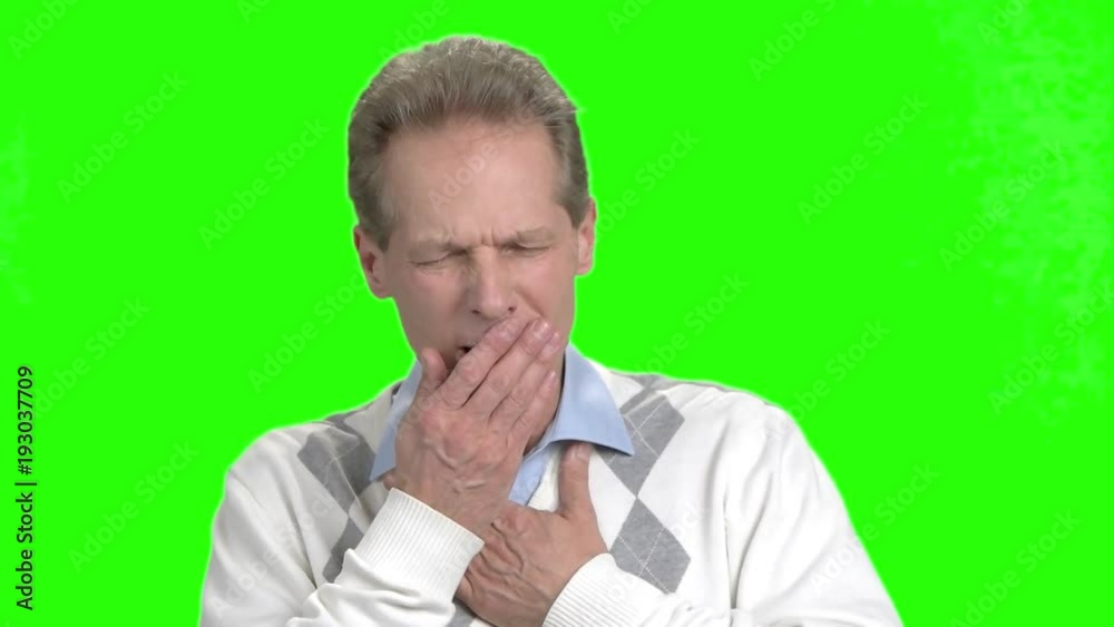 Mature man is coughing on chroma key background. Middle aged man is coughing on green background. Close up man having cough on Alpha Channels background.