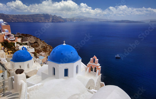 Blue dome church of beautiful Oia in Greek Island of Santorini, Greece