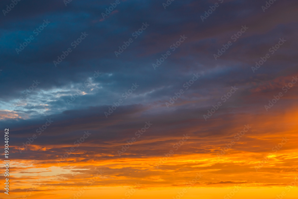 dramatic vibrant colorful clouds during sunset