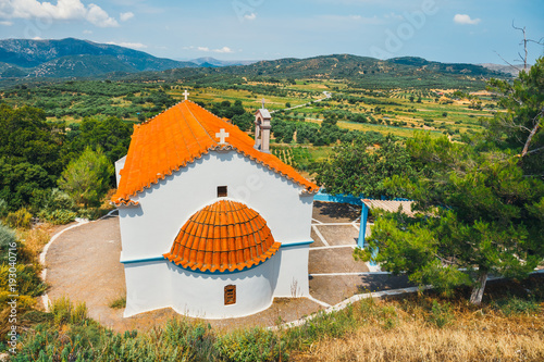 White chapel and mountains in the backgroud, Crete Island, Greece photo