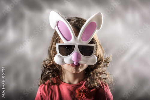Little girl with the Easter bunny mask