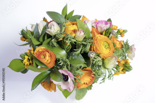 wedding bouquet of buttercups  anemones and Ruscus