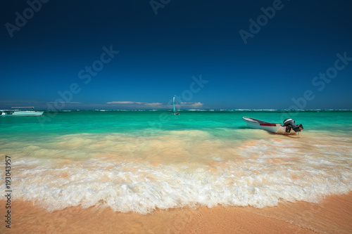 Carribean sea and speed boat on the shore, beautiful panoramic view