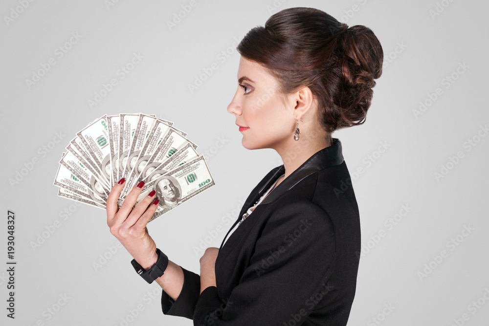 Profile side businesswoman , holding many cash Profile side businesswoman , holding many cash