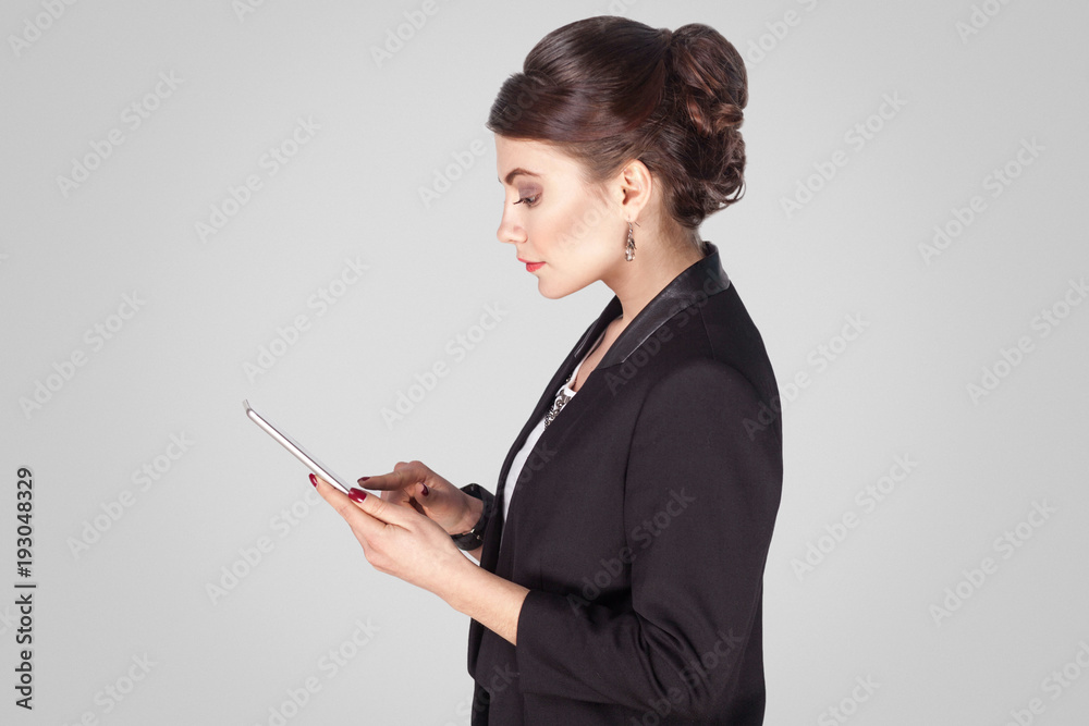 Profile side businesswoman , holding smart phone, sending sms Profile side businesswoman , holding smart phone, sending sms
