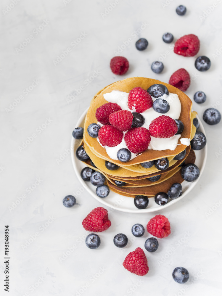 Delicious crepes with fresh blueberry and raspberry. An healthy meal of Pancakes with berries. Delicious crepes with fresh blueberry and raspberry. An healthy meal of Pancakes with berries.