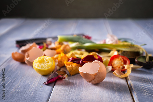 Organic leftovers, kitchem scraps, waste from vegetable ready for recycling and to compost. Collecting food leftovers for composting. Environmentally responsible behavior, ecology concept. Copy space. photo