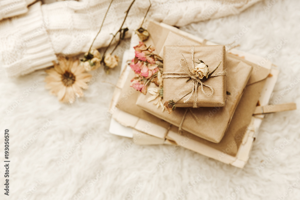 Top view composition with gift boxes. Wrapped present on cozy background Top view composition with gift boxes. Wrapped present on cozy background