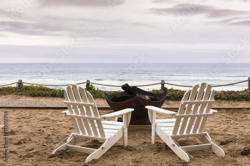 White chair overlooking beach © Brett