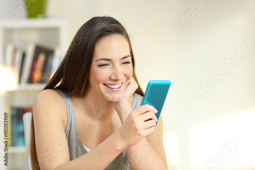 Girl enjoying watching media content on a smart phone