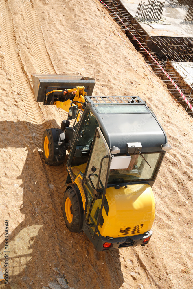 Construction machine at the construction work. Top view Construction machine at the construction work. Top view