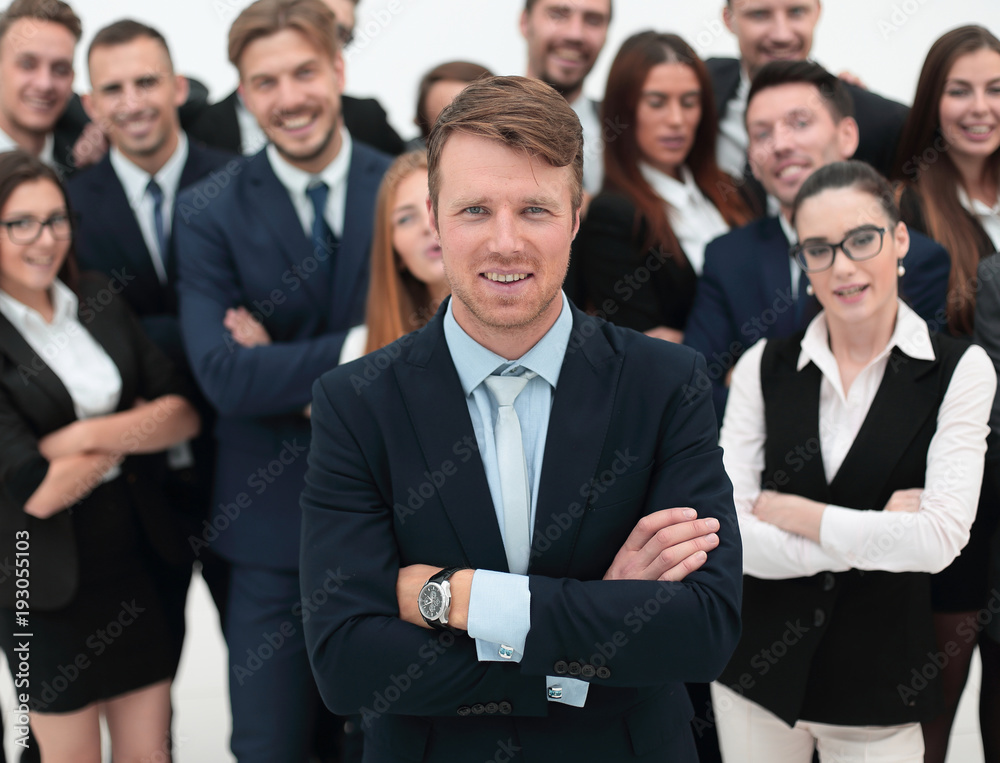 happy businessman standing on background of her business team. happy businessman standing on background of her business team.