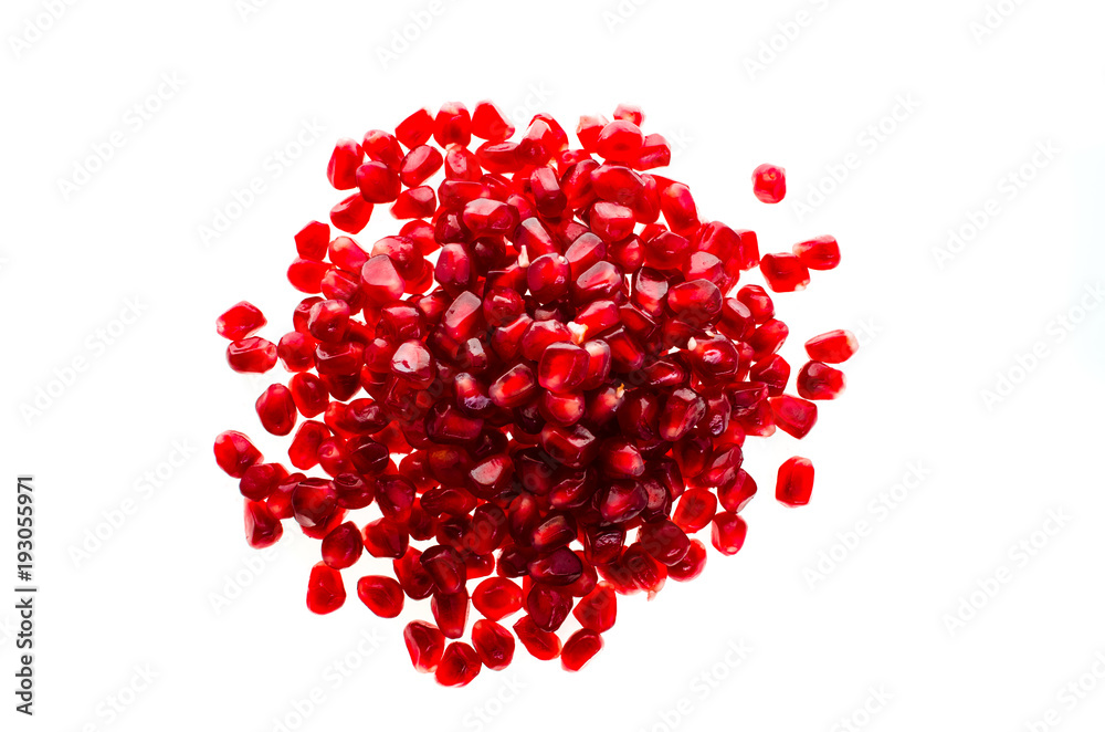 Pile of fresh ripe pomegranates on white isolated background