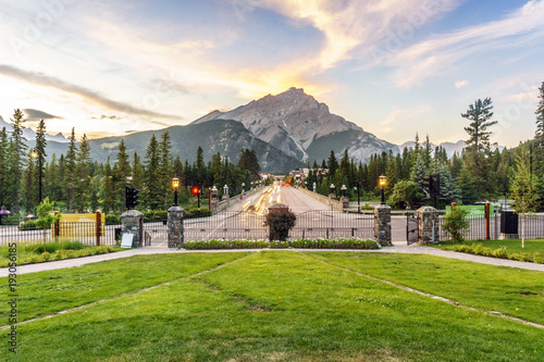 Main street in Banff with Cascade Mountain towering over town, Alberta, Canada photo