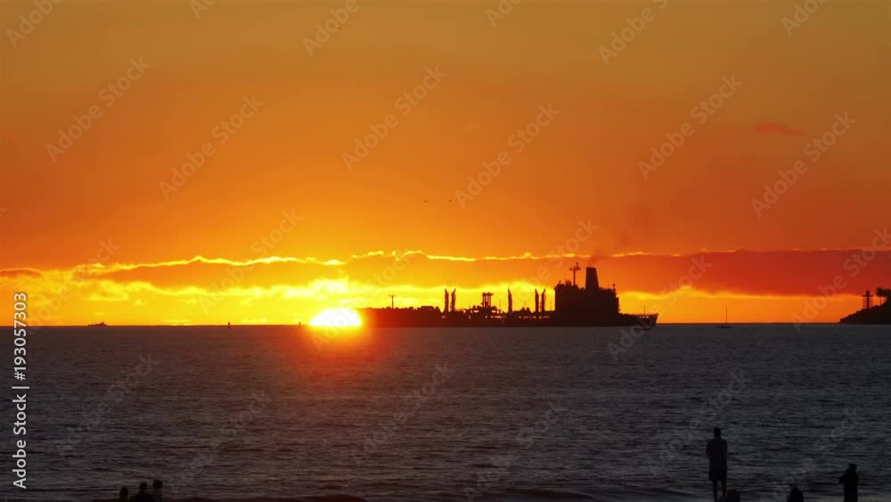 Professional video of cargo container ship sailing on the sea at sunset in 4k slow motion 60fps Professional video of cargo container ship sailing on the sea at sunset in 4k slow motion 60fps