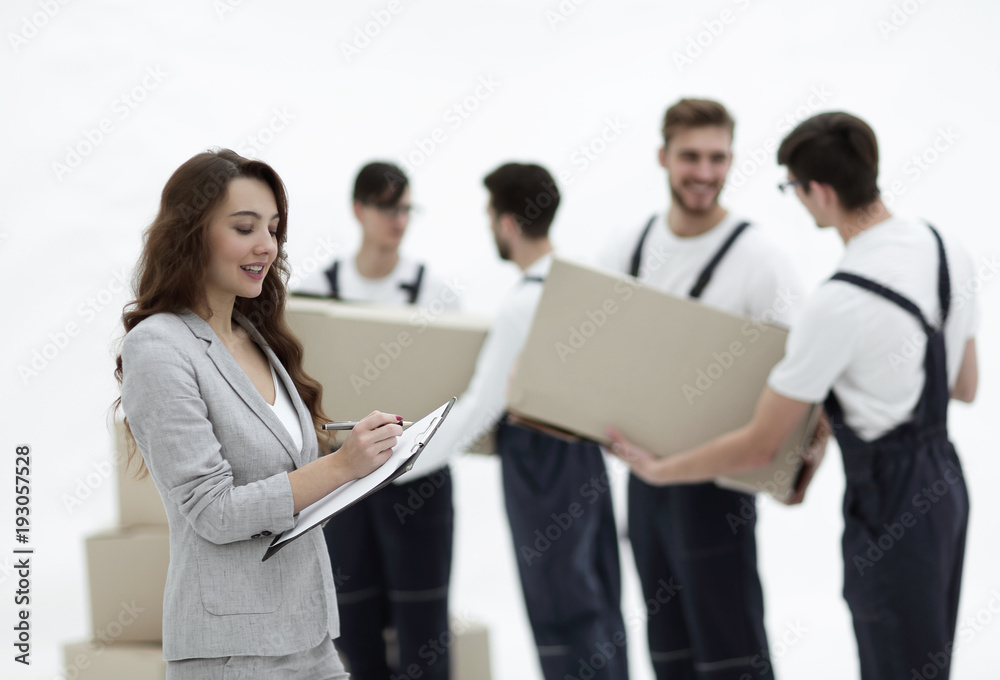 Businessman with documents, creating a stack of cardboard boxes. Businessman with documents, creating a stack of cardboard boxes.
