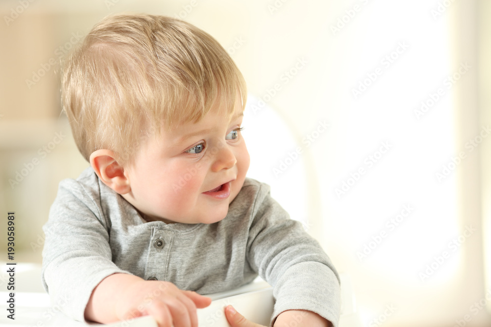 Portrait of a happy kid looking at side